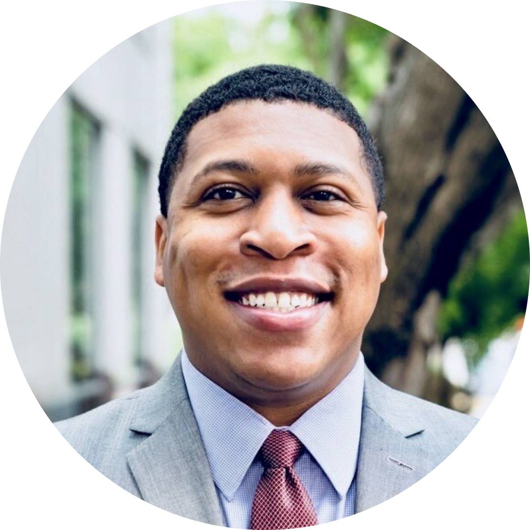 Eli Glover smiling for his professional headshot